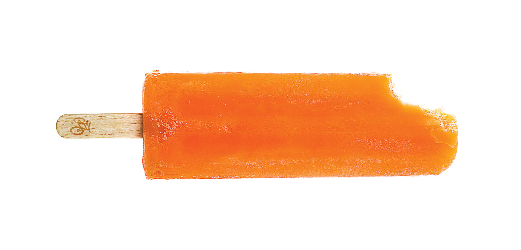 An orange popsicle with the Great Park Neighborhoods logo on the stick